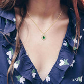 1/3 ctw Starburst 6X4MM Pear Cut Emerald and Round Cut Diamond Precious Pendant With Chain in 14K Yellow Gold